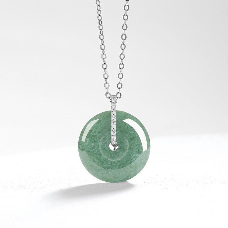 BoxUnboxed natural green jadeite peace buckle charm pendant on a delicate S925 silver chain against a clean white background.