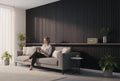 BoxUnboxed acoustic slat wood panels in dark wood veneer with black felt backing, creating a modern accent wall.