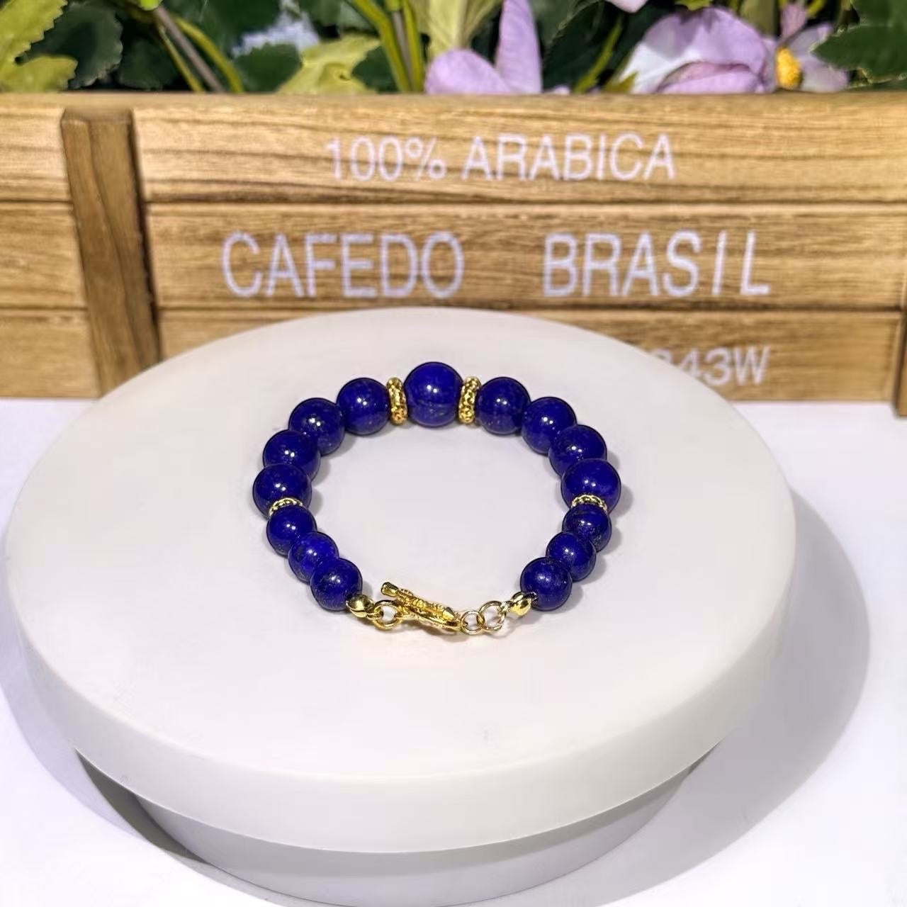 BoxUnboxed natural Afghan Lapis Lazuli beaded bracelet with gold-plated spacer wheels and a gold toggle clasp.