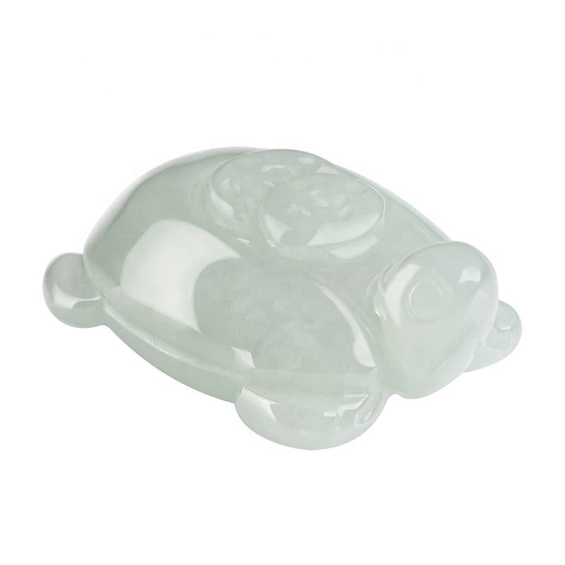 BoxUnboxed hand-carved natural Grade-A jadeite turtle talisman with a smooth, polished light green finish.