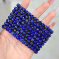BoxUnboxed natural Afghan Lapis Lazuli beaded bracelet featuring deep indigo stones with subtle golden pyrite inclusions.