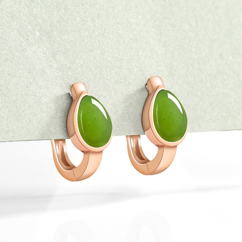 BoxUnboxed huggie earrings featuring teardrop-shaped natural nephrite jade in rose gold plated sterling silver settings.