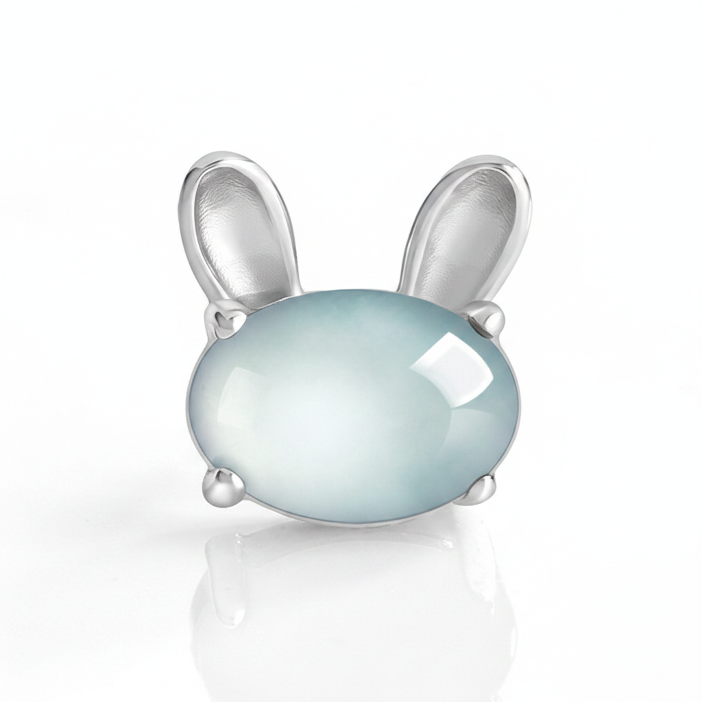 Natural blue water jadeite lunar rabbit stud earrings — close-up macro showing icy blue jade clarity and silver prong detail, BoxUnboxed